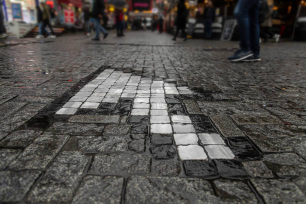 Rainy day, wet cobblestones, people walking