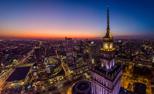 Warsaw city center and Warsaw skyscrapers at dusk aerial view