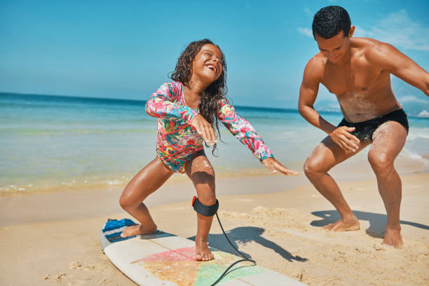 istock Perfect day for surfing with dad 1204429252