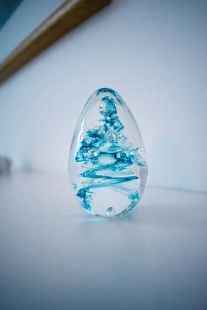 istock Beatiful egg made of glass with blue paint inside 1204429320