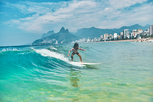 Fearless little brazilian girl surfing like a pro