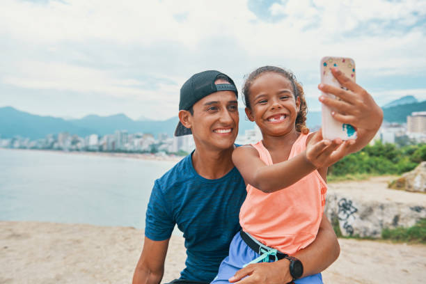istock Father and daughter selfie time 1204429594