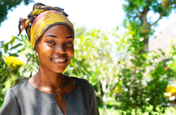 Tanzania Zanzibar January 22 2020 Beautiful African Woman In Colorful  Headwrap On Tropical Nature Background On Sunny Day Stock Photo - Download  Image Now - iStock