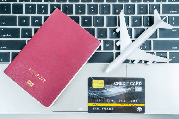 istock Credit card and passport on keyboard 1204434057