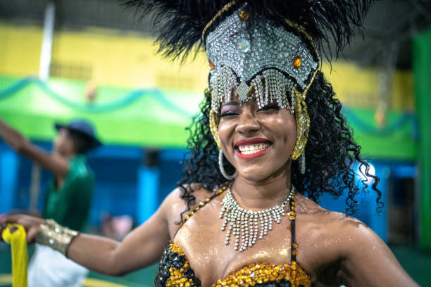 Portrait of woman (passista) celebrating and dancing at brazilian carnival Portrait of woman (passista) celebrating and dancing at brazilian carnival samba dancing stock pictures, royalty-free photos & images