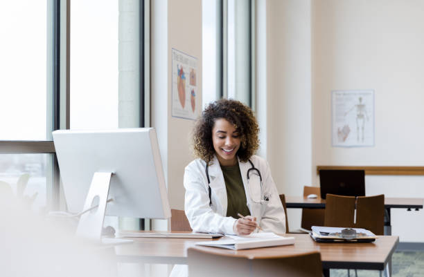 istock Cheerful doctor reviewing patient's file 1204436216