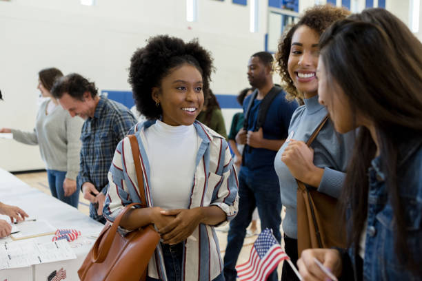 istock Group of friends laughs and chats after voting 1204436374