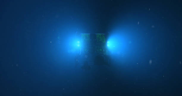 Underwater ROV A deep sea ROV - remote operated vehicle, with it's lights penetrating the darkness of the bottom of the ocean underwater camera stock pictures, royalty-free photos & images