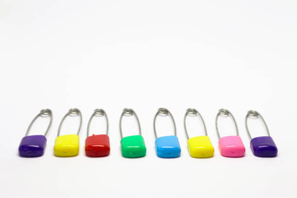 istock Colorful safety pin isolated on white background 1204438070