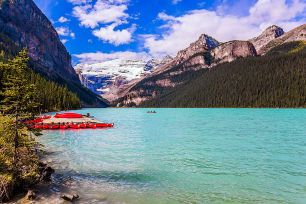 istock Glacial Lake Louise. Red canoes 1204440758
