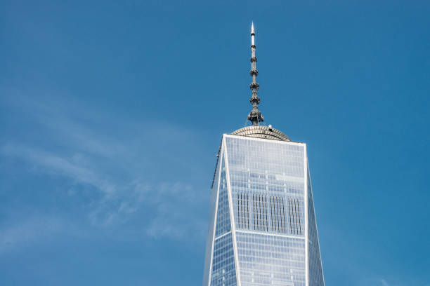 One World Trade Center - Detail The top section of One World Trade Center in Lower Manhatten, on a clear and sunny day in New York City. one world trade center photos stock pictures, royalty-free photos & images