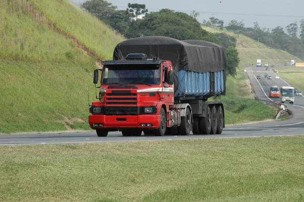 no brand fierce looking old semi truck on major highway no brand fierce looking old semi truck on major highway old truck stock pictures, royalty-free photos & images