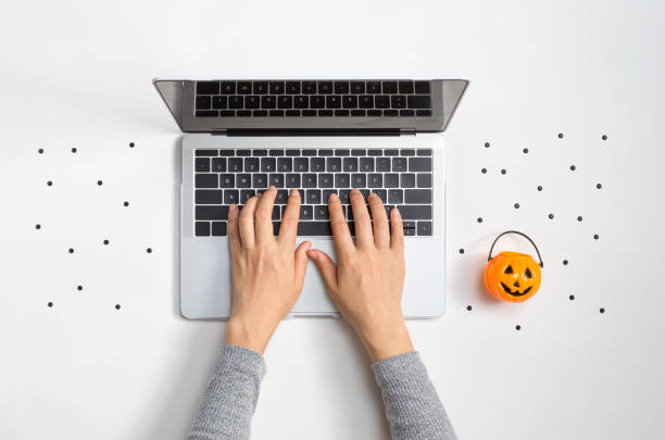 istock Halloween theme with laptop 1204447137
