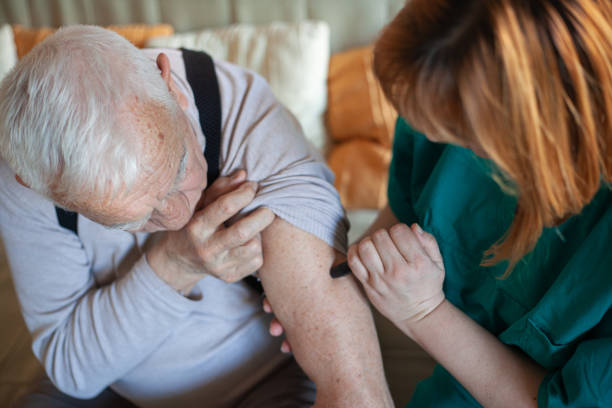 istock Nurse administering insulin to an elderly man 1204447226