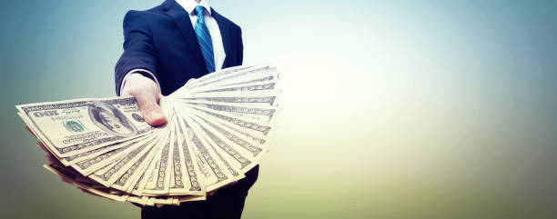 istock Business man with cash 1204447254