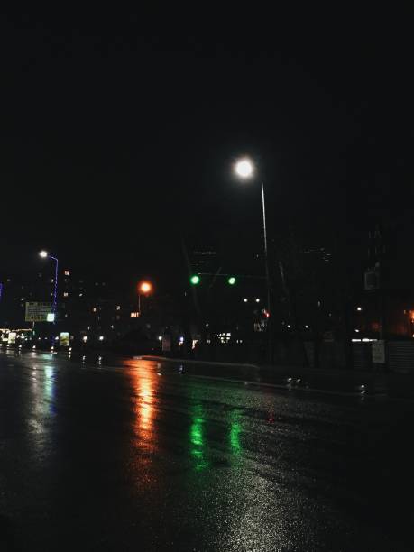 istock City at night. Wet road 1204447283