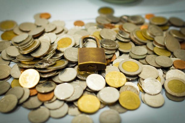 istock Coin money and lock, on gray background. Saving and financial security concept. 1204447628