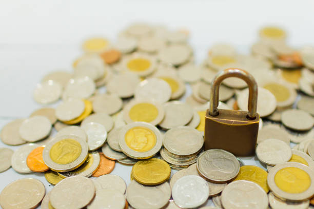 istock Coin money and lock, on gray background. Saving and financial security concept. 1204447710