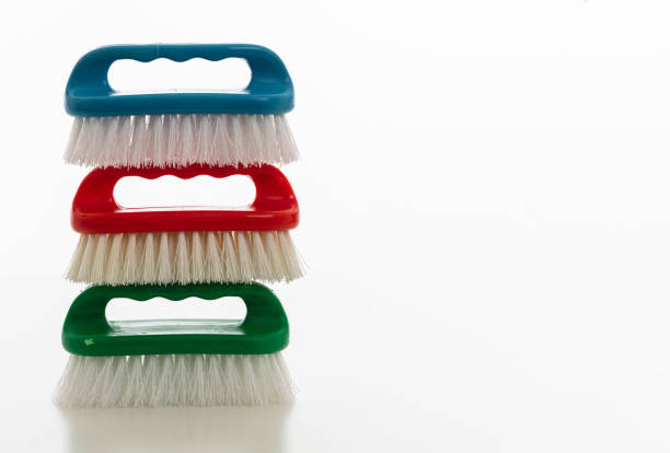 Cleaning brushes isolated against white background. Plastic brushes vibrant colors, hand tools, household cleaning supplies, copy space