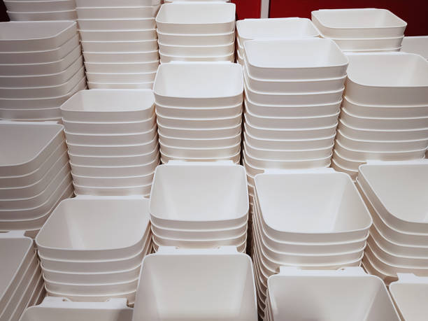istock Full Frame Background of Group of Stacked White Plastic Containers 1204448627