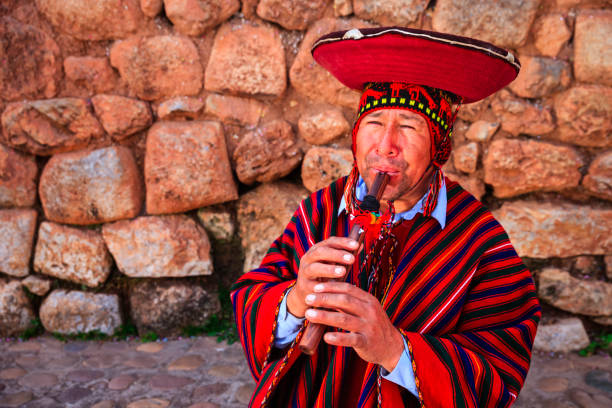 istock Portrait of Peruvian man playing a flute, Sacred Valley 1204451786