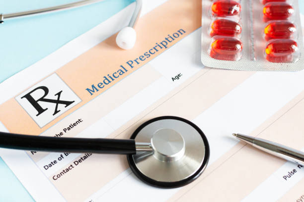 istock Medical prescription with doctor's sthetoscope and pills. 1204452178