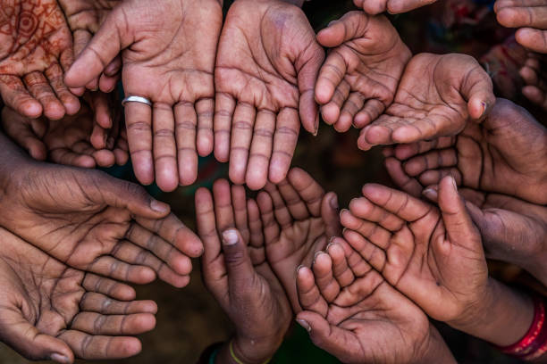 istock Hunger in Africa - hands asking for food 1204452376