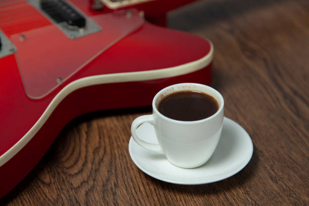 istock guitar with cup of coffee 1204453239