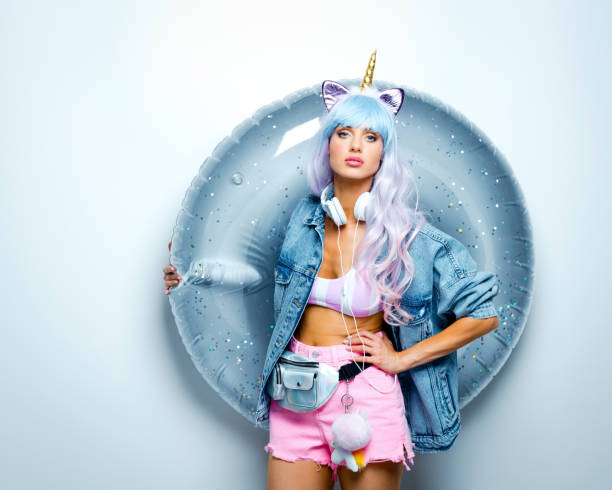 istock Manga style confident young woman holding inflatable ring 1204458268