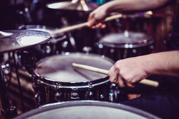 drummer hitting some snare drum rolls - trommel stock-fotos und bilder