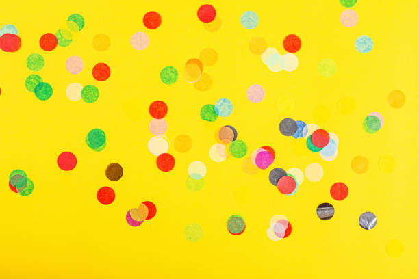 istock banner with confetti on yellow background, top view. Flat lay style. Mock up, template, overhead. Background for birthday, 8 march, Valentine's day, wedding, Mother's day 1204460974