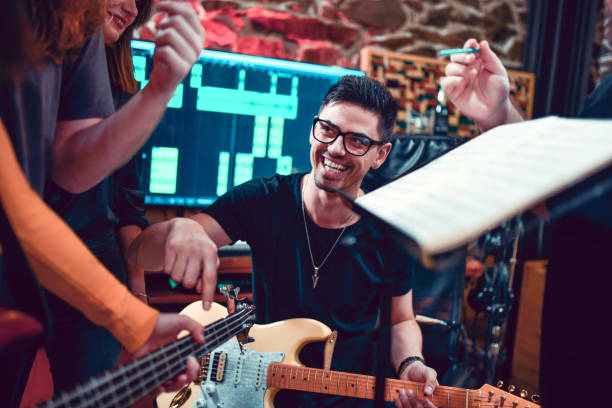 istock Band Having Fun In Music Studio 1204461158