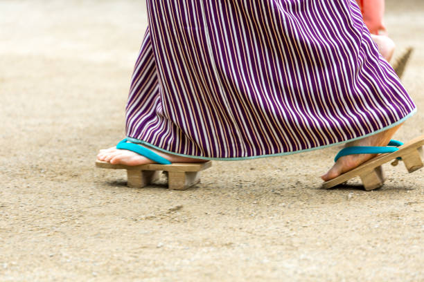 Feet of Japanese woman in traditional dress Feet of Japanese woman in traditional dress geta sandal stock pictures, royalty-free photos & images