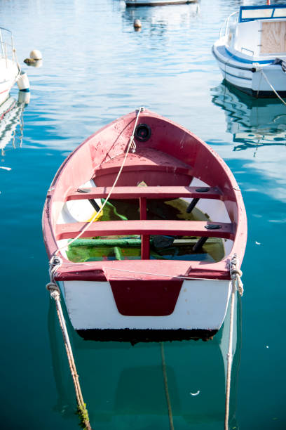 istock Light boats anchored by the beach 1204463331