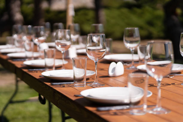 istock Served wooden table without a tablecloth. Cafe in the open air park 1204463436