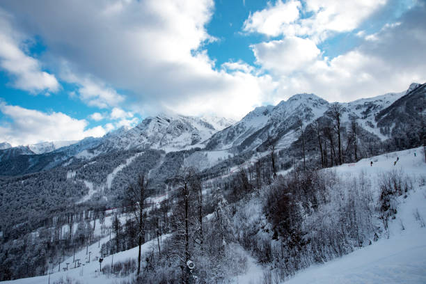 istock mountain ski resort Rosa Khutor in Sochi.  Winter sunny day with cloudy 