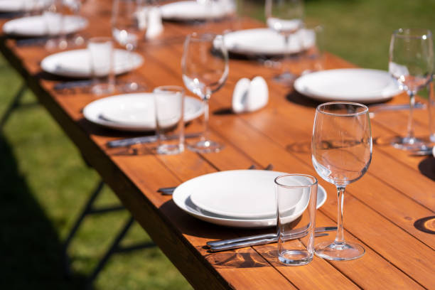 istock Served wooden table without a tablecloth. Cafe in the open air park 1204463539