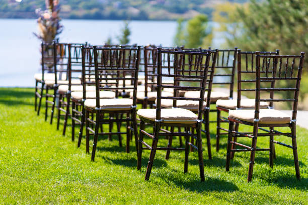 istock Rows of chairs for guests at an open-air wedding ceremony. 1204464412