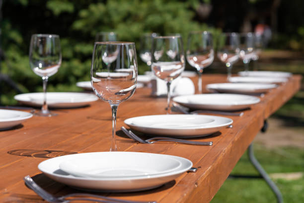 istock Served wooden table without a tablecloth. Cafe in the open air park 1204464455