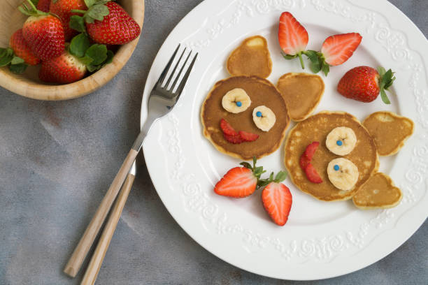 istock Funny bunny pancakes with fruits 1204464877