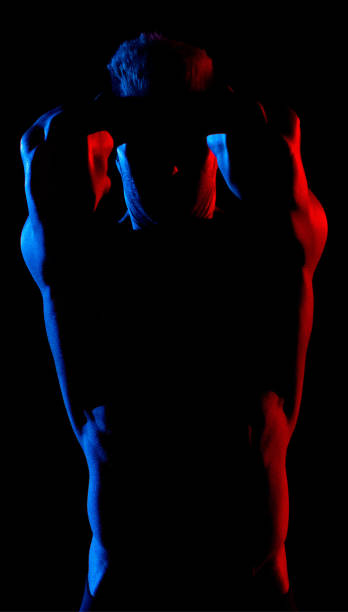 istock Caucasian young male in front of black background 1204465101