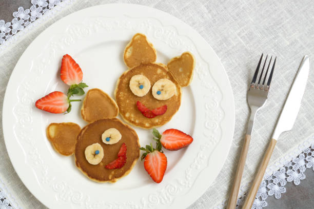 istock Funny bunny pancakes with fruits 1204465378