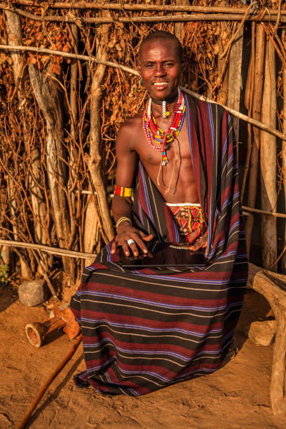 istock Young man from Erbore tribe using a digital tablet, Ethiopia, Africa 1204466774