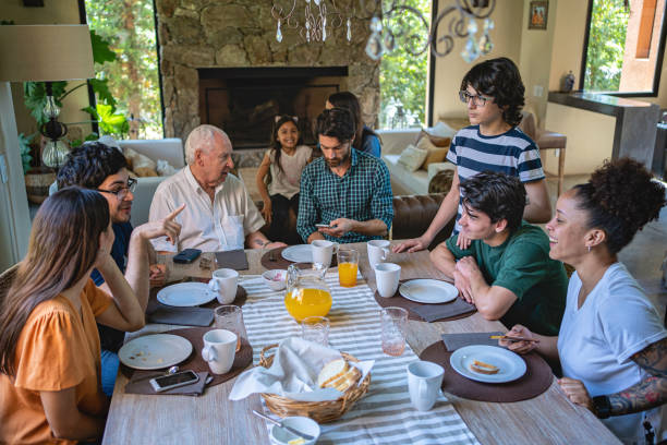 istock Big Latin family together at breakfast 1204468173