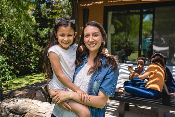 istock Lovely single mother holding her cute daughter 1204468641
