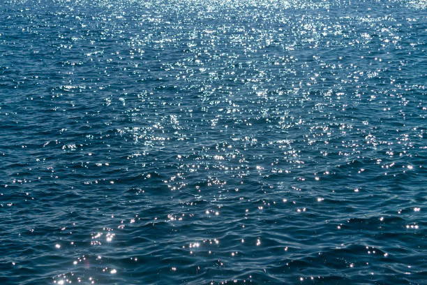 istock Shiny blue sea water background 1204469504