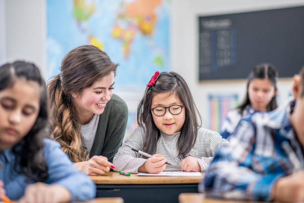 istock Teacher Helping a Student stock photo 1204471188