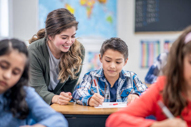 istock Teacher Helping a Student stock photo 1204471192