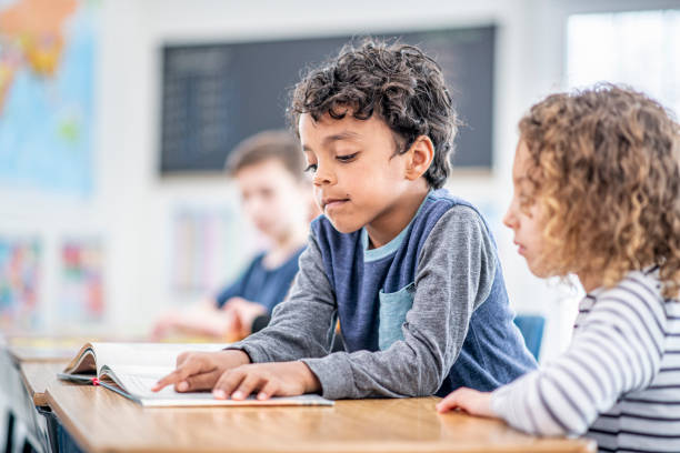istock Students Reading Together stock photo 1204471240