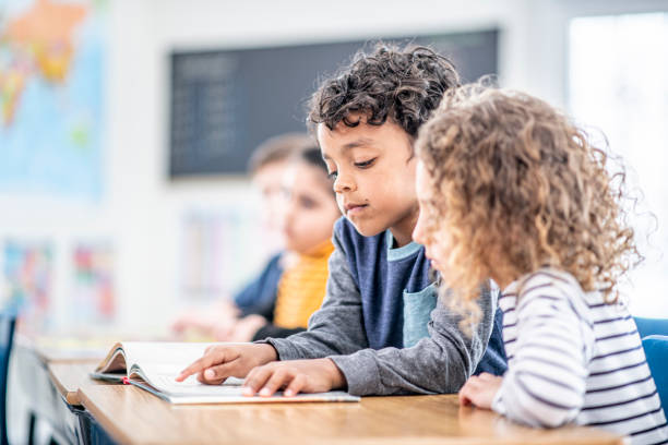istock Students Reading Together stock photo 1204471413